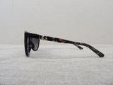 a pair of sunglasses sitting on a white surface