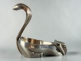 an image of a silver cat shaped bowl sitting on top of a table