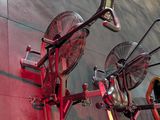 a red bike that is sitting on the ground