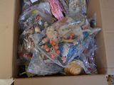 a cardboard box filled with lots of different types of toys
