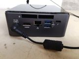 a small computer with two usb ports connected to it