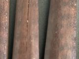 three baseball bats that are sitting next to each other