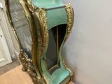 a clock that is sitting on top of a wooden table
