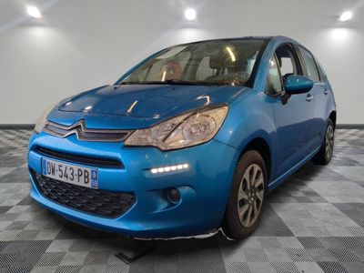 a picture of a blue citrole car in a showroom
