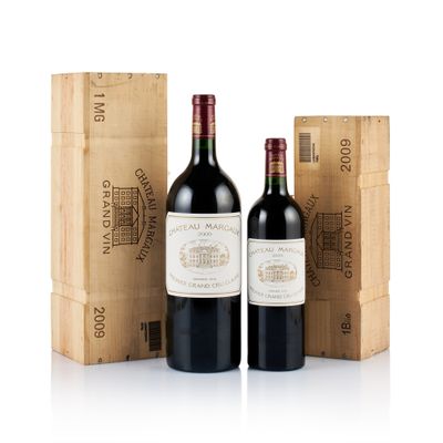 three bottles of red wine sitting next to a wooden box