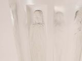 a clear glass vase with a design on it