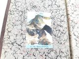 a picture of a book with a picture of a mountain on it