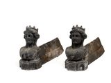pair of cast iron busts of a woman with a crown on her head