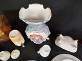 many different pieces of porcelain on the table