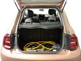 the back of a car with the trunk open and a hose in the trunk