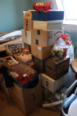 many boxes stacked on top of each other in a room