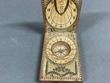 a small clock that is sitting on a table