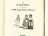 un vieux livre sur lequel figure le dessin d'une femme et d'un homme
