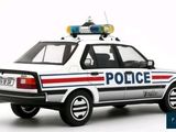 a white police car with red and blue lights on top of it