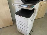 a printer that is sitting on top of a cabinet
