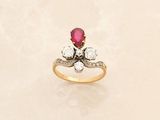 an image of a diamond and ruby ring on a white background