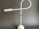 an image of a white lamp on a stand on a gray background