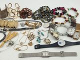 many different types of jewelry on the table