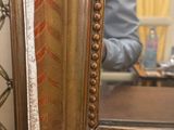a reflection of a man in the mirror of a room