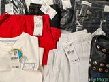 a lot of clothing that is on display in the store