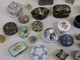 many different types of decorative boxes on the table