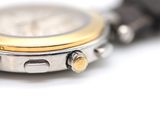 a close up of a watch on a white surface