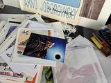 a pile of assorted books on a table