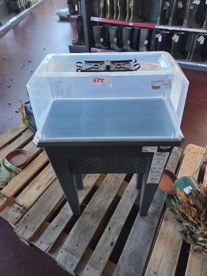 a sink that is sitting on a pallet in a store