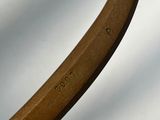a close up of a wooden handle on a chair