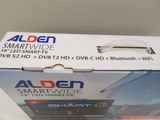 an open box of a smart tv sitting on top of a table