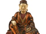 une image représentant une statue de Bouddha assis sur une surface blanche