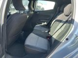 the back seats of a car are empty in the parking lot
