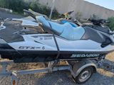 a white and black jet ski parked on a trailer