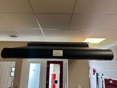 a long black tube hanging from the ceiling