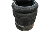 a stack of four tires stacked on top of each other