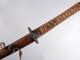 a close up of a samurai sword on a white background