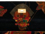 an image of a purse with a skull on it