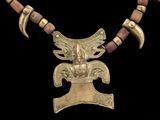an image of a necklace made of metal and wood with a bird on it