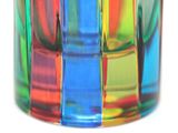 a colorful glass vase with different colors on it