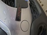 a sticker on the front of a car that says caution