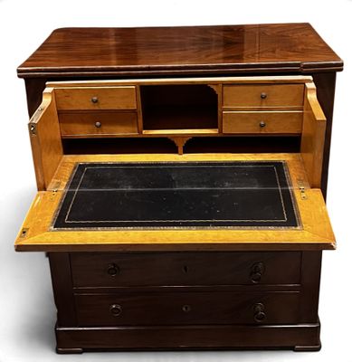 a wooden desk with a glass top and drawers underneath it