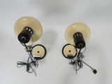two lamps that are sitting on a white surface