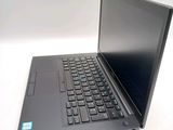 a laptop with a black keyboard on a white surface