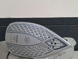 a white and black iron sitting on top of a white table