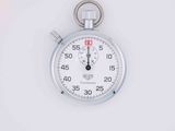 a stopwatch on a white surface with a white background