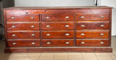a large wooden dresser with many drawers on it