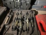 many tools in the case that are sitting on the floor