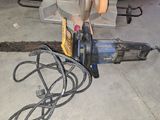 a machine that is sitting on the ground next to a pile of wires
