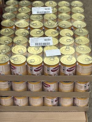 many cans of canned food stacked on top of each other