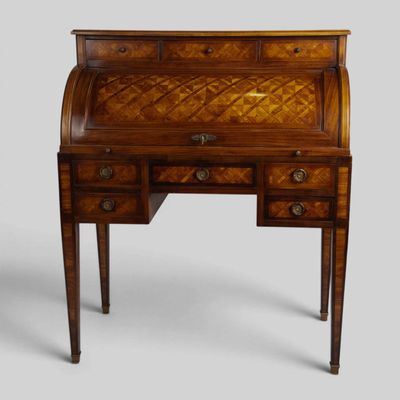 an antique writing desk with drawers and drawers on top of it